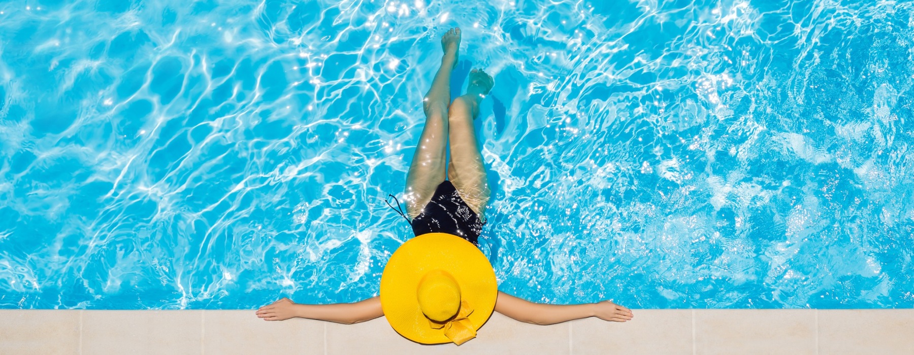 person in swimming pool - EDE luxury apts Frederick MD