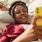 a person looking at a phone on a sofa - EDE downtown Frederick MD apartments 