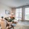 living room couch and chair by coffee table and tv EDE downtown Frederick MD apartments