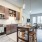 Kitchen island with seating area and accent open shelving