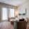 living room couch and chair by coffee table and tv EDE downtown Frederick MD apartments