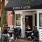 a group of people sitting outside a restaurant - EDE downtown Frederick MD apartments 