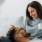 a man and woman lying on a couch and smiling - EDE Frederick MD luxury apartments